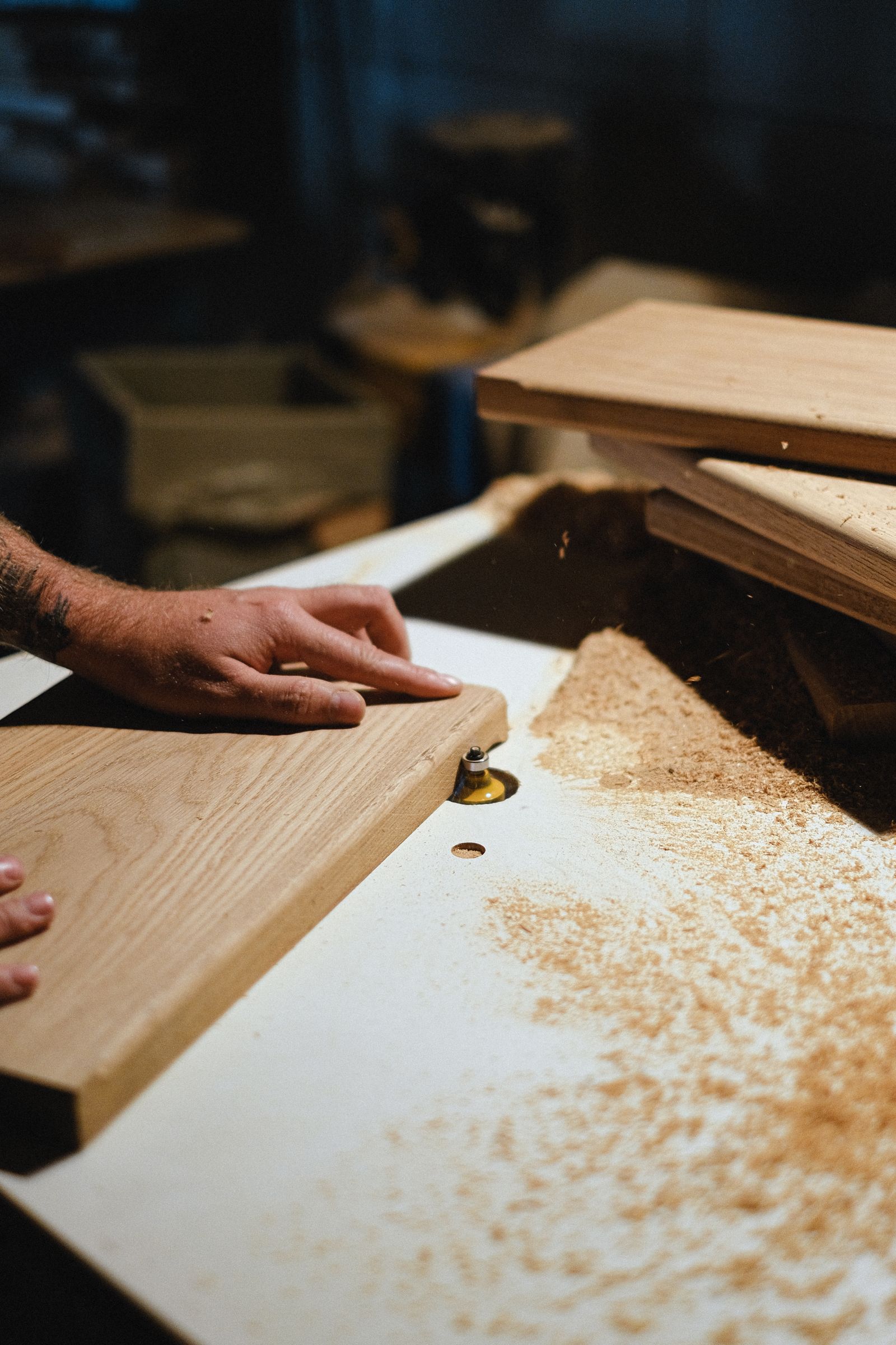 Hand-finishing a wood plank on the bench
