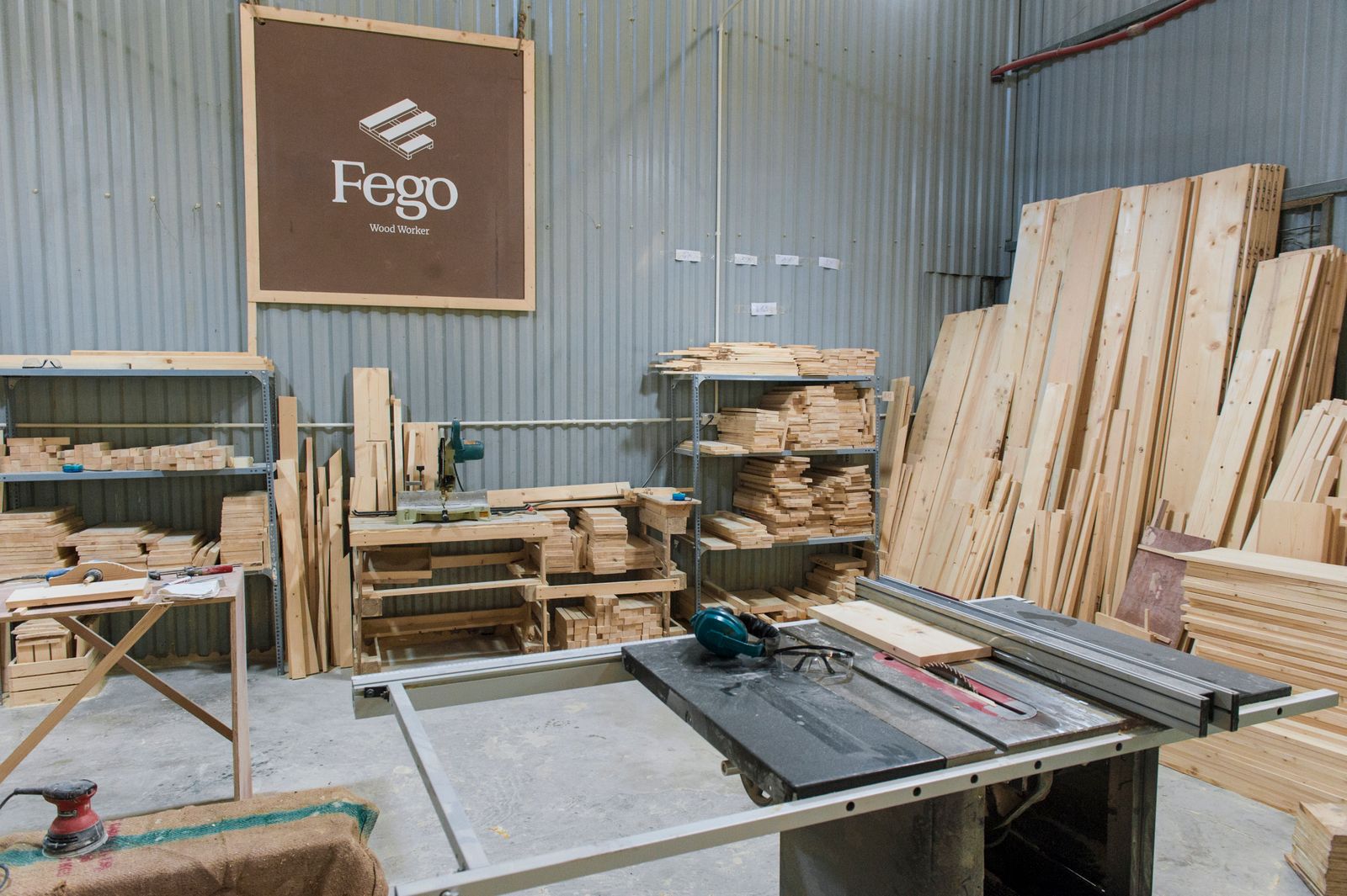 Inside the workshop, timber stacked and ready